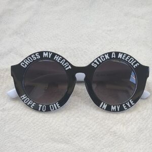 Stylish Black Sunglasses with Bold Text Design